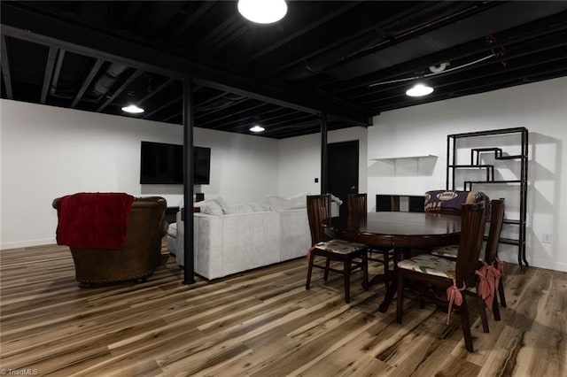 dining room featuring baseboards and wood finished floors