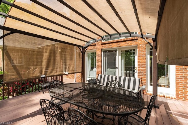 deck with a pergola and outdoor dining area