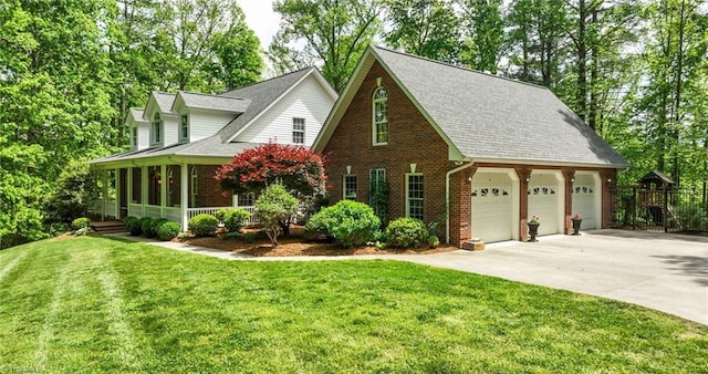 view of front of property featuring concrete driveway, a front yard, brick siding, and covered porch