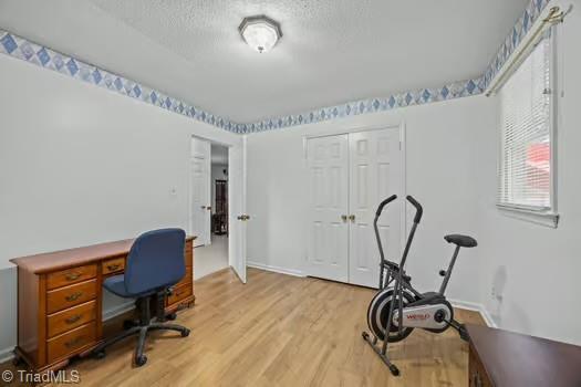 1630 Ploughboy Ln, Winston-Salem, NC 27103 - office space with light wood-type flooring and a textured ceiling