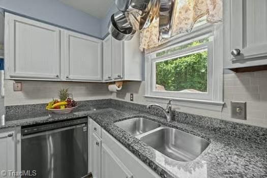 1630 Ploughboy Ln, Winston-Salem, NC 27103 - kitchen featuring dishwashing machine, white cabinets, decorative backsplash, and dark stone countertops