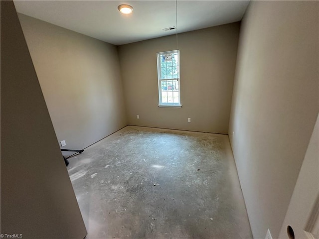 311 W Market St, Graham, NC 27253 - spare room featuring concrete floors