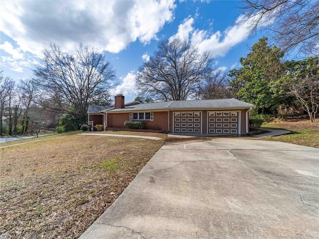 single story home featuring concrete driveway, a chimney, and a garage