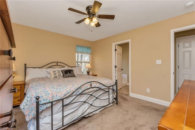 bedroom with ceiling fan and light colored carpet