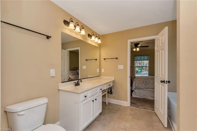 bathroom featuring ceiling fan, vanity, and toilet