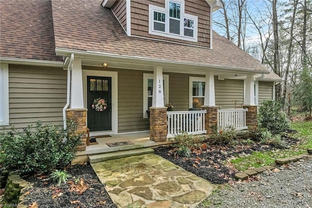 doorway to property featuring a porch