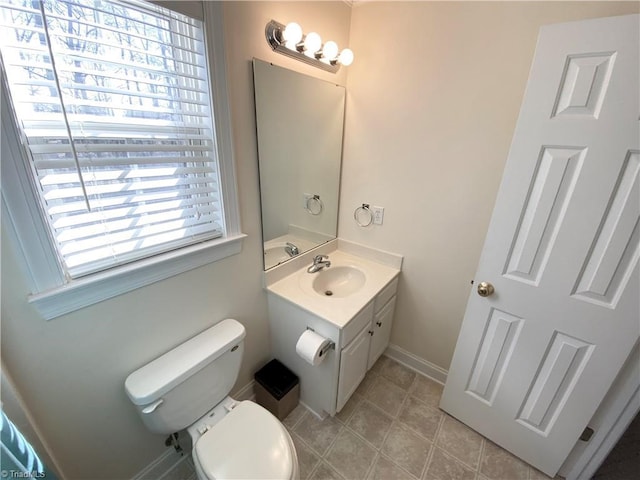 bathroom with vanity, tile patterned floors, and toilet