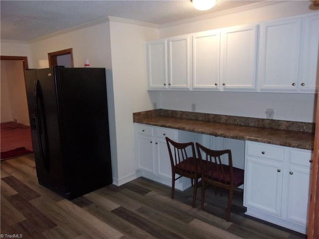 kitchen with white cabinets, dark wood-type flooring, and black refrigerator with ice dispenser