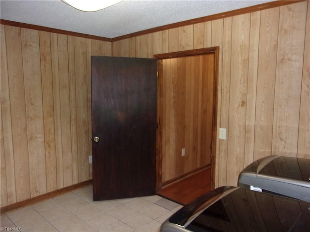 tiled bedroom with wooden walls and a textured ceiling