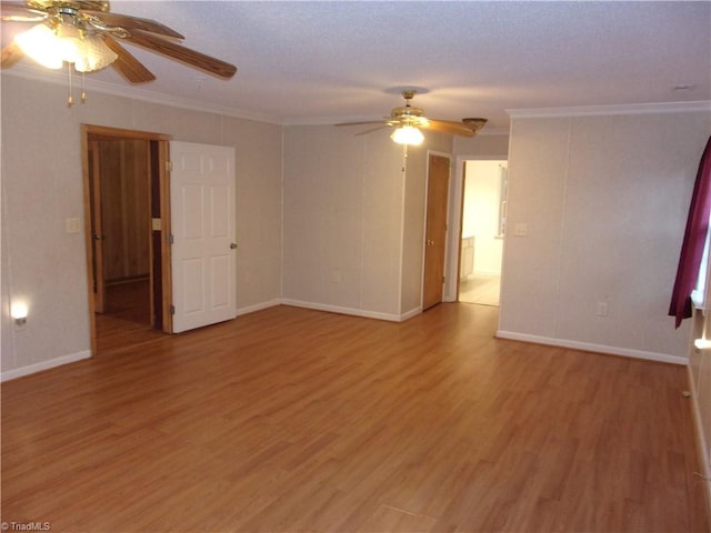 empty room featuring wood-type flooring, ceiling fan, a textured ceiling, and crown molding