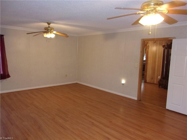 unfurnished room with wood-type flooring, ornamental molding, and ceiling fan