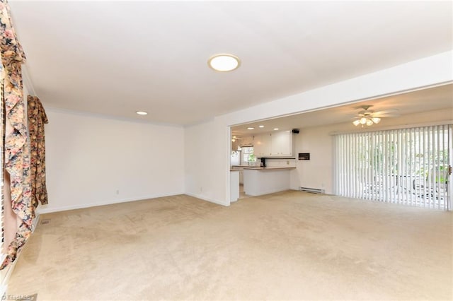 unfurnished living room with recessed lighting, baseboards, ceiling fan, light carpet, and baseboard heating