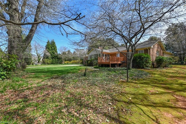 view of yard with a wooden deck