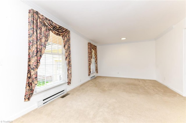 unfurnished room featuring baseboards, ornamental molding, baseboard heating, and light colored carpet