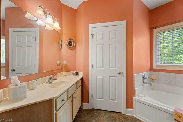 6065 Providence Church Rd, Winston-Salem, NC 27105 - bathroom with a bath, vanity, and baseboards