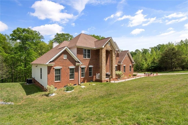 6065 Providence Church Rd, Winston-Salem, NC 27105 - exterior space featuring crawl space, brick siding, a lawn, central AC, and a chimney