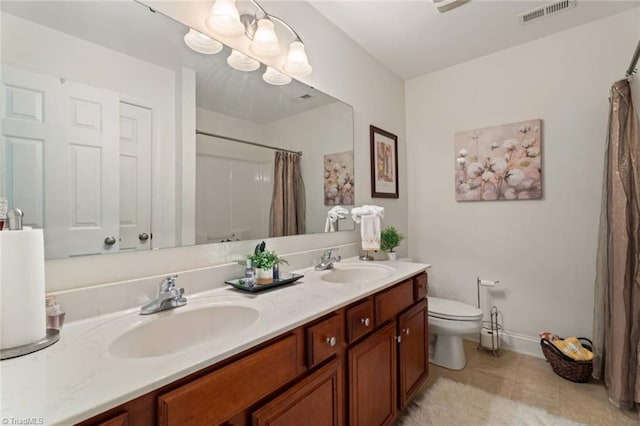 6065 Providence Church Rd, Winston-Salem, NC 27105 - bathroom with a sink, double vanity, visible vents, and baseboards