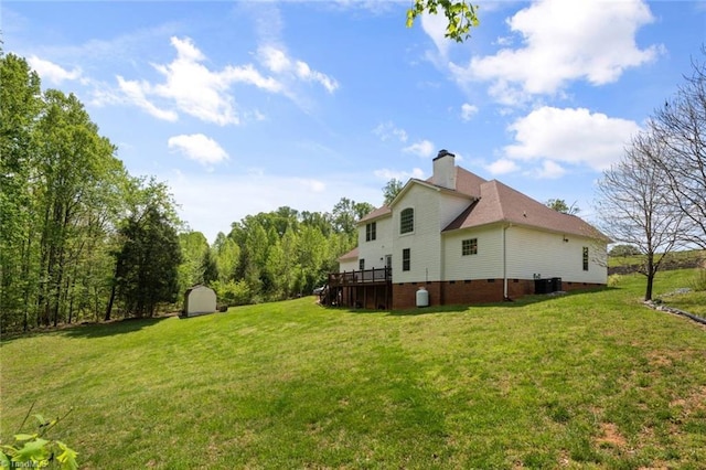 6065 Providence Church Rd, Winston-Salem, NC 27105 - exterior space featuring an outdoor structure, a deck, cooling unit, and a shed