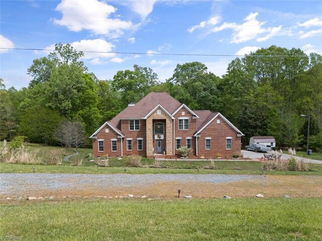 6065 Providence Church Rd, Winston-Salem, NC 27105 - view of front of property featuring brick siding and a front lawn