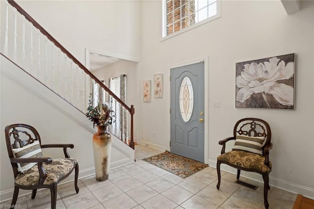 6065 Providence Church Rd, Winston-Salem, NC 27105 - entryway with visible vents, baseboards, light tile patterned flooring, a towering ceiling, and stairs