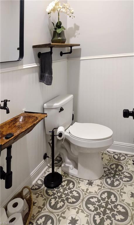 bathroom featuring tile patterned floors and toilet