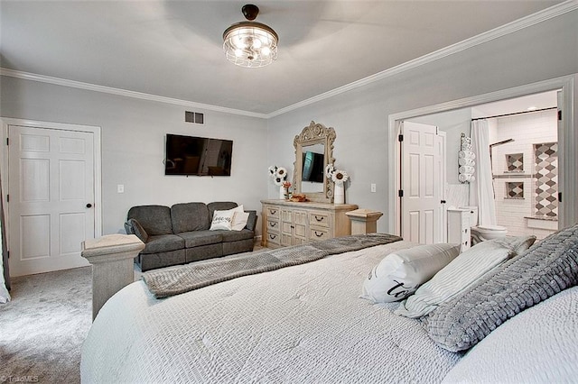 bedroom with ensuite bathroom, carpet, and crown molding