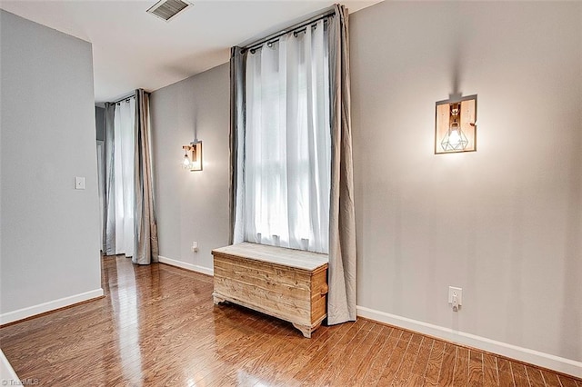 spare room featuring hardwood / wood-style flooring