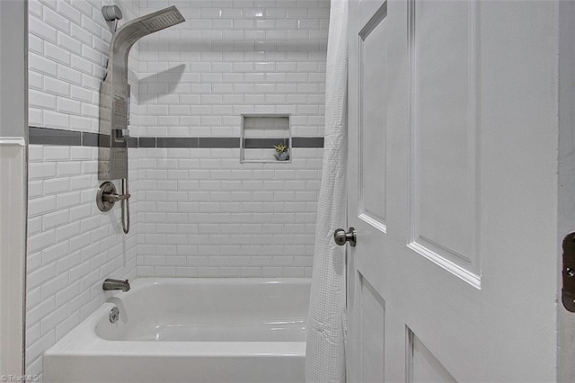 bathroom featuring shower / bathtub combination with curtain