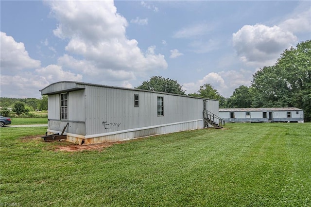 1105 Cabana Ln, East Bend, NC 27018 - rear view of house featuring a lawn and entry steps