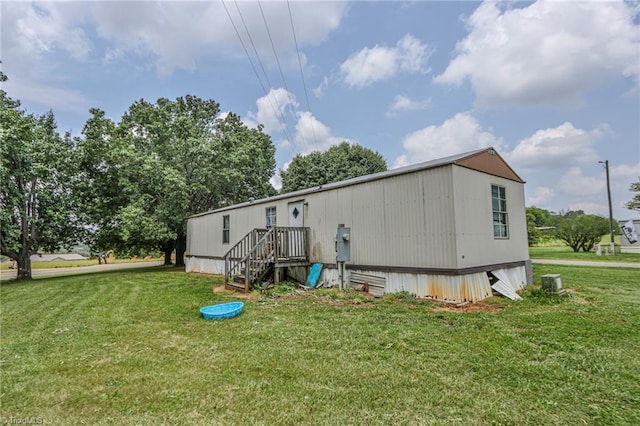 1105 Cabana Ln, East Bend, NC 27018 - rear view of house with a yard and central AC unit