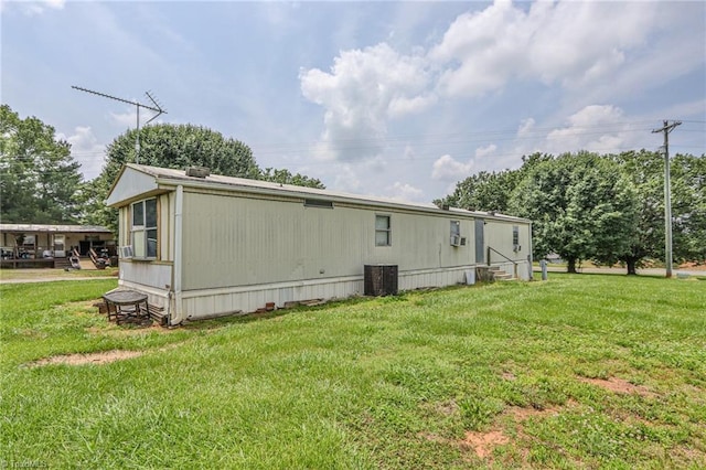 1105 Cabana Ln, East Bend, NC 27018 - view of property exterior featuring central air condition unit and a yard