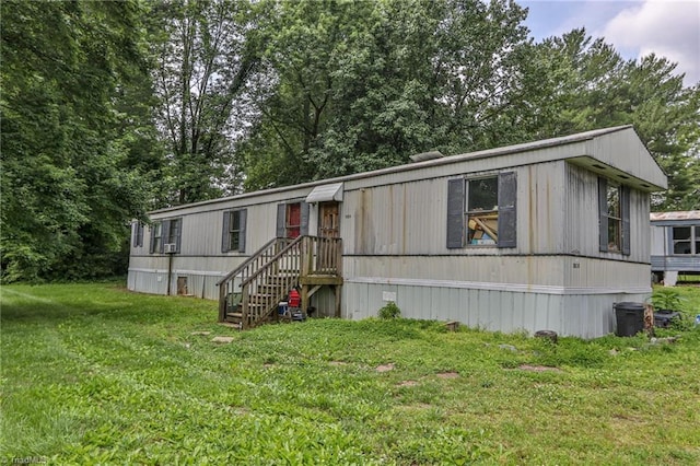 1105 Cabana Ln, East Bend, NC 27018 - manufactured / mobile home featuring a front yard and view of scattered trees