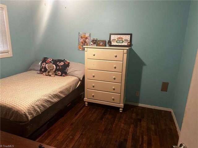 bedroom featuring dark hardwood / wood-style floors