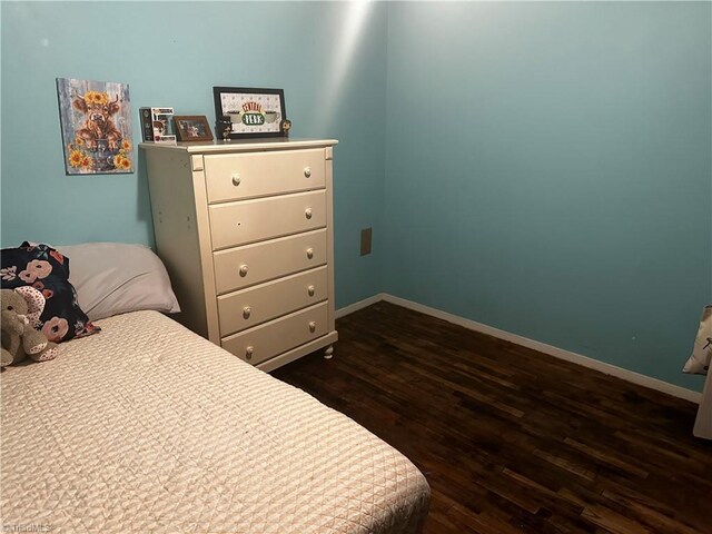 bedroom featuring dark hardwood / wood-style floors