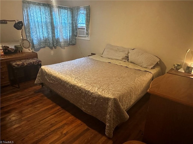 bedroom featuring dark wood-type flooring