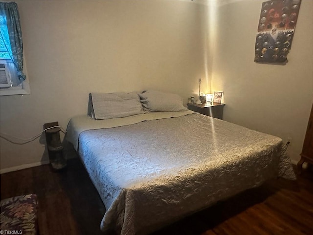 bedroom featuring dark wood-type flooring