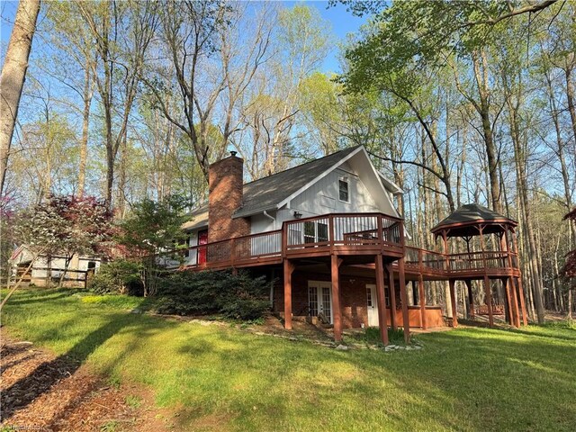 245 Clontz Hill Rd, Troutman, NC 28166 - rear view of house featuring a wooden deck, a lawn, a chimney, and french doors