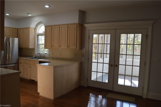 kitchen featuring french doors, sink, stainless steel fridge, and dark hardwood / wood-style floors