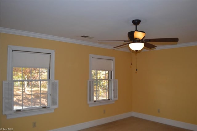 spare room featuring ornamental molding and ceiling fan