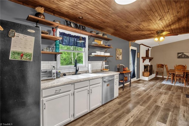 3809 Evergreen Dr, Trinity, NC 27370 - kitchen featuring stainless steel dishwasher, open shelves, wooden ceiling, freestanding refrigerator, and backsplash
