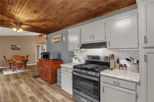 3809 Evergreen Dr, Trinity, NC 27370 - kitchen with stainless steel gas stove, under cabinet range hood, wood ceiling, a ceiling fan, and backsplash
