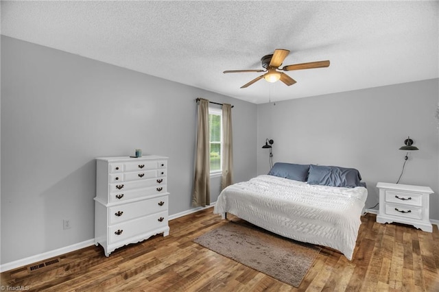 3809 Evergreen Dr, Trinity, NC 27370 - bedroom with wood finished floors, a textured ceiling, and ceiling fan