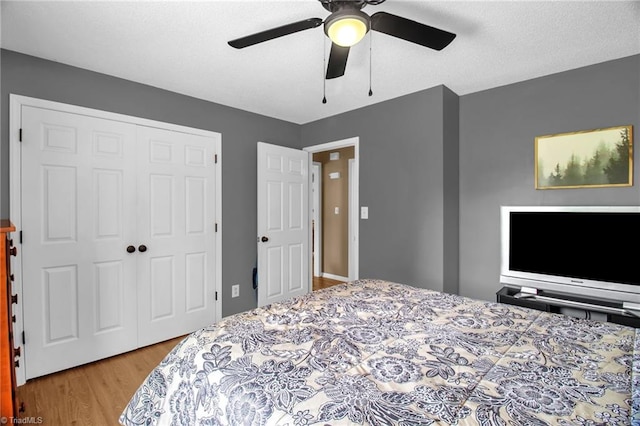 3809 Evergreen Dr, Trinity, NC 27370 - bedroom featuring wood finished floors, a closet, and ceiling fan