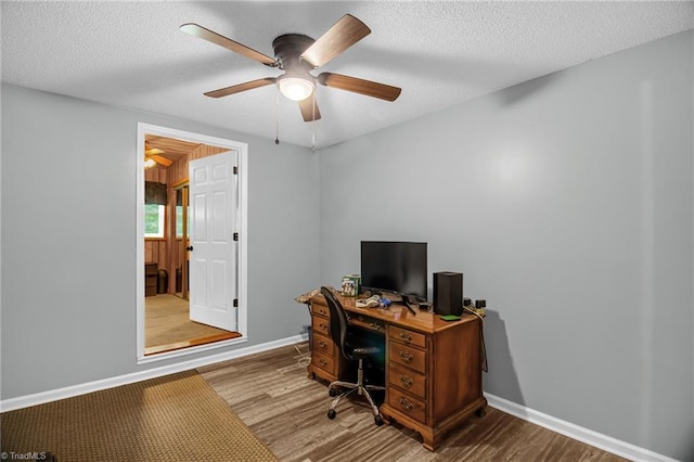 3809 Evergreen Dr, Trinity, NC 27370 - office area featuring wood finished floors, a textured ceiling, and a ceiling fan
