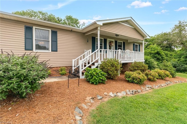 3809 Evergreen Dr, Trinity, NC 27370 - ranch-style home featuring covered porch and a front lawn