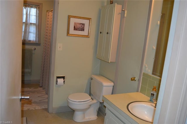 bathroom with toilet and vanity