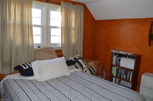 bedroom featuring vaulted ceiling