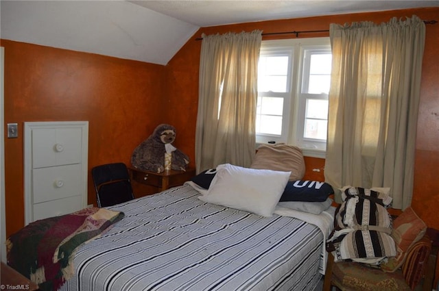 bedroom with lofted ceiling