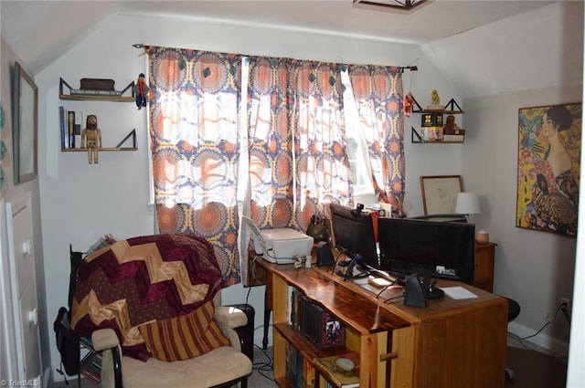 office area with vaulted ceiling