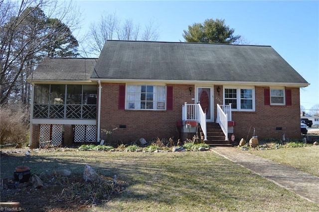 view of front of house with crawl space, brick siding, and a front lawn